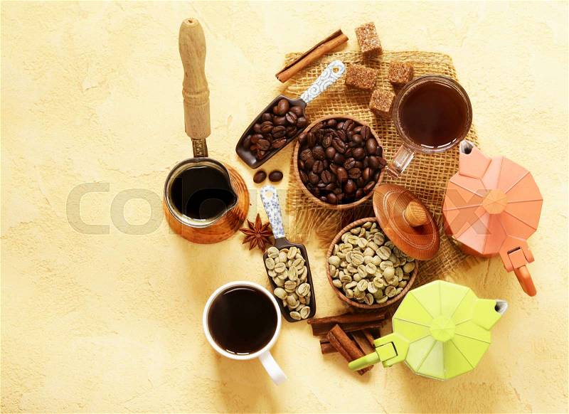 Still life of coffee - green and brown beans and spices, cinnamon and anise, stock photo