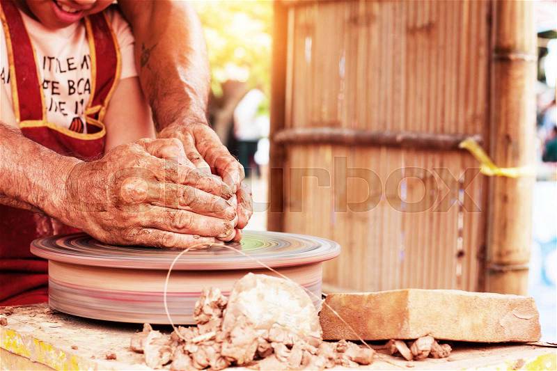 Girls are hand-made pottery in the countryside, stock photo