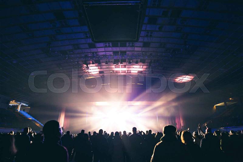 Large concert hall filled with spectators before the stage, stock photo