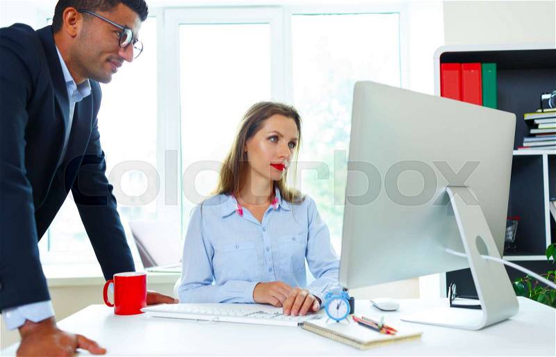 Beautiful young woman and man working from home - modern business concept, stock photo