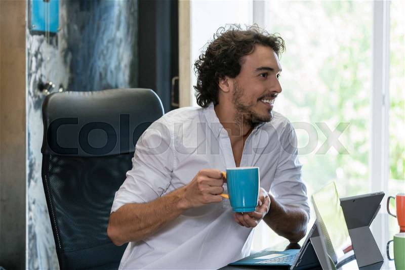 Employee in creative industries having coffee and talk, stock photo