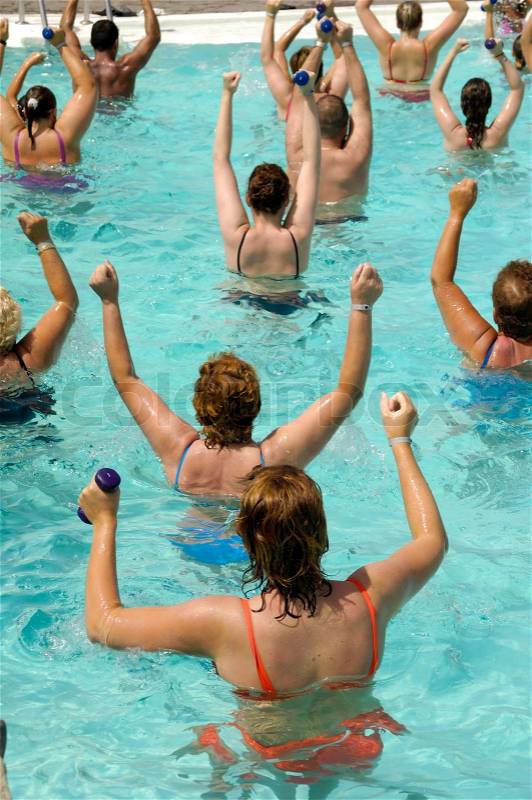 People doing aerobic in a swimming pool, stock photo