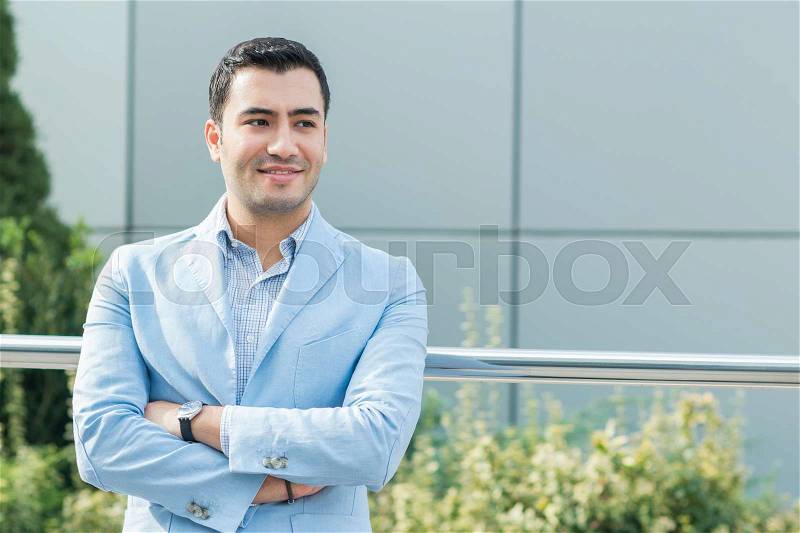 Portrait of gorgeous young man. Happy turkish man, outdoor - outside, stock photo