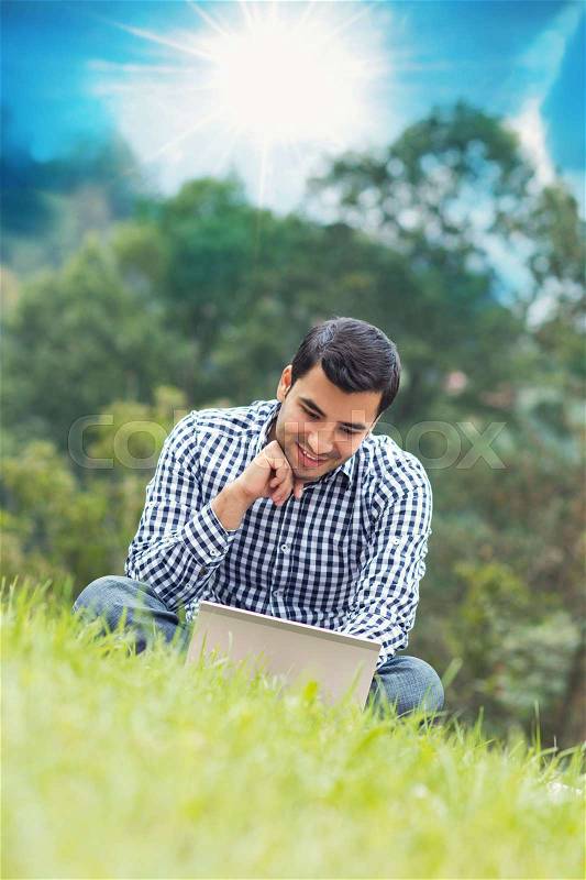 Happy young man with laptop, outdoor - outside , stock photo