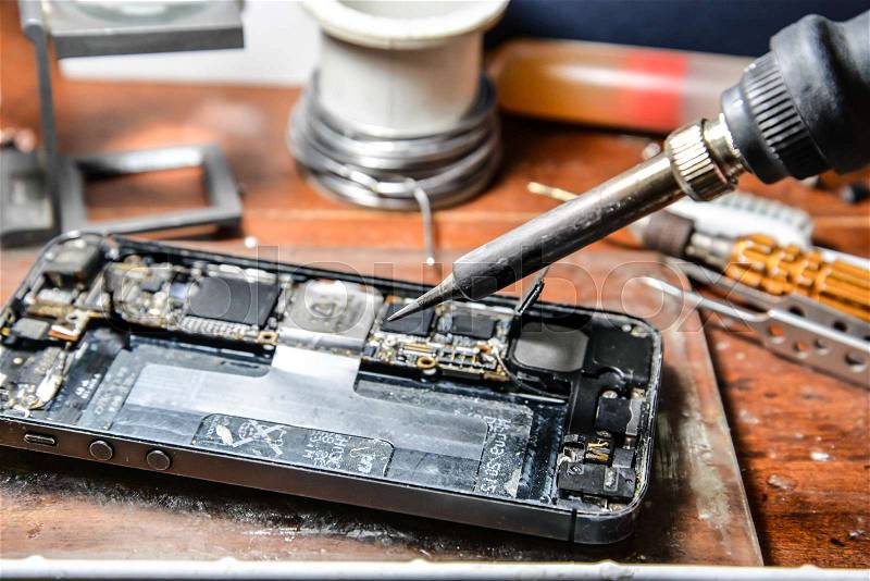 Repairing mobile phone, stock photo