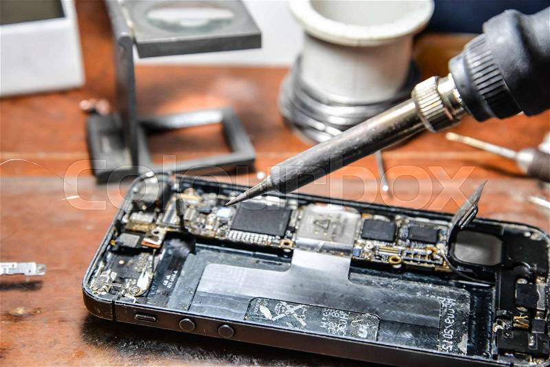 Repairing mobile phone, stock photo
