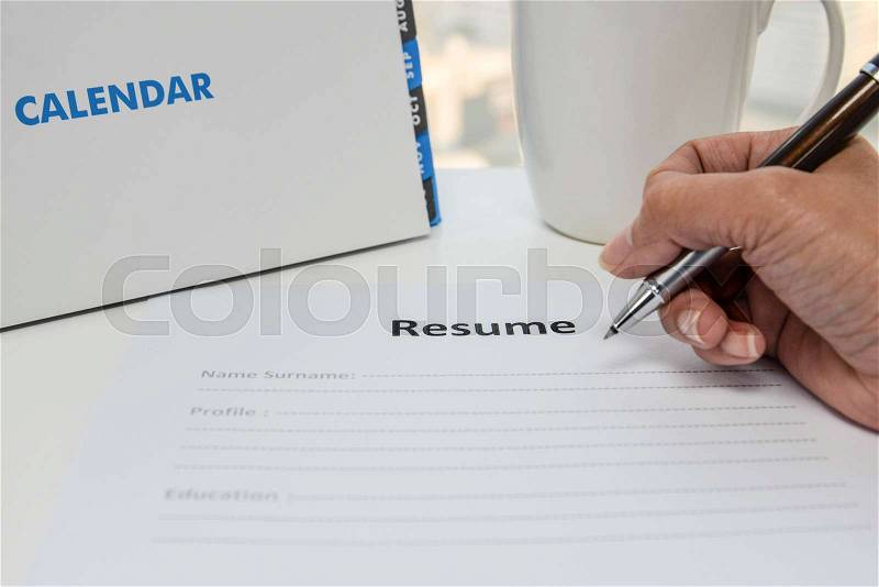 Writing Resume on the white table, stock photo