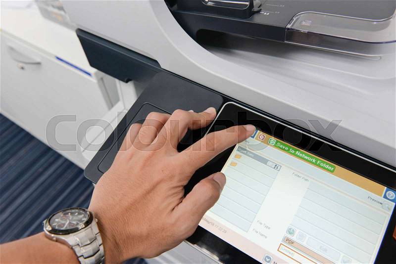 Human hand is using the printer, stock photo