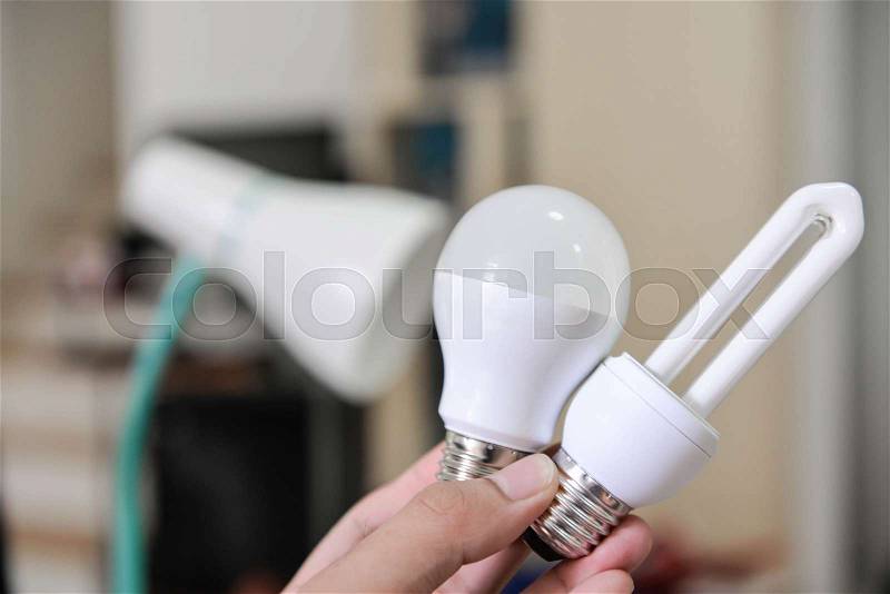 LED Bulb - Selection the bulb to use with lamp, changing the bulb to LED bulb to install in lamp for saving the energy, concept for how to select the bulb, stock photo