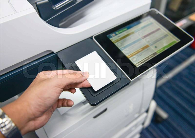Using the access card on printer to printing the document, stock photo
