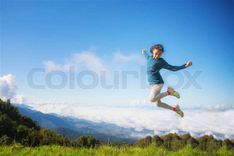 Freedom girl in Kew Mae Pan, doi inthanon view, Chiang Mai, Thailand, mountain, play, travel, mist, cool, jump, winter concept.23614590\