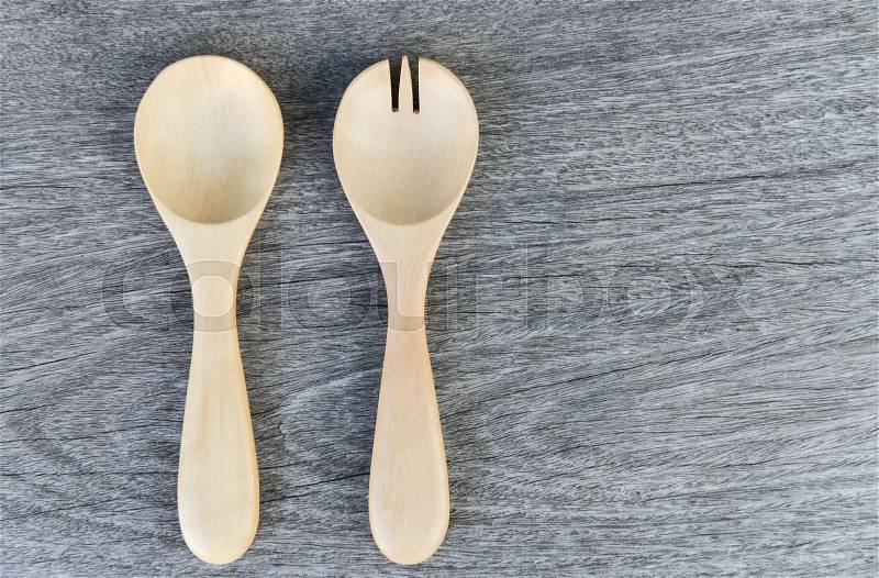 Wooden fork and spoon on the wooden table, stock photo