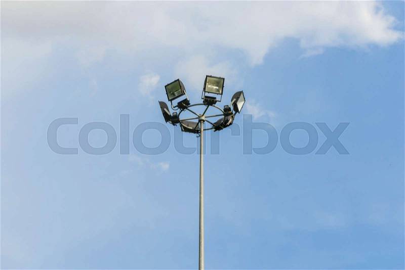 Sport Light tower under blue sky, stock photo