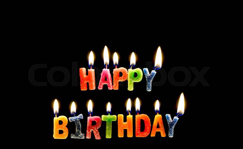 Colorful of happy birthday candle with flame lighting on the black screen, stock photo