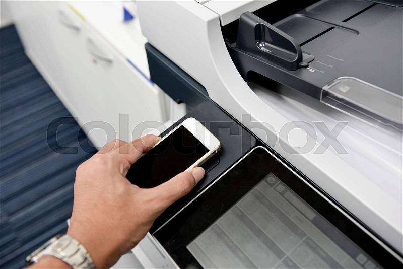 Using smart phone with printer to printing document, stock photo