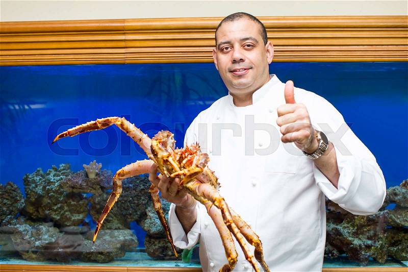 Chef of the fish restaurant with seafood lobster crab octopus, stock photo