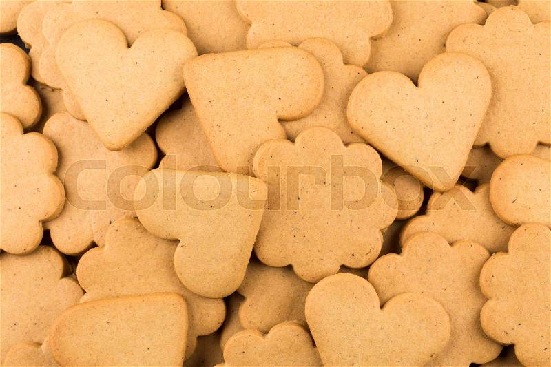 Gingerbread hearts cookies as a background. Christmas decoration, stock photo