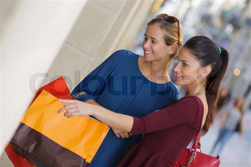 Young happy and wealthy women shopping, stock photo