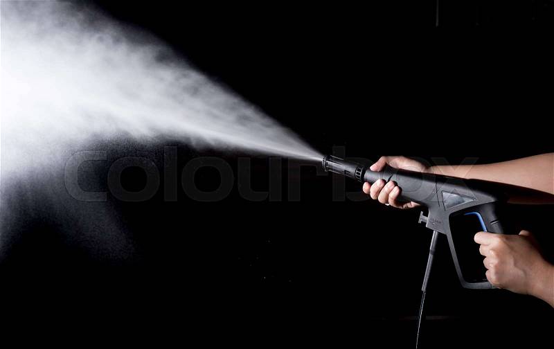 Water splashes with high pressure water jet on black background, stock photo