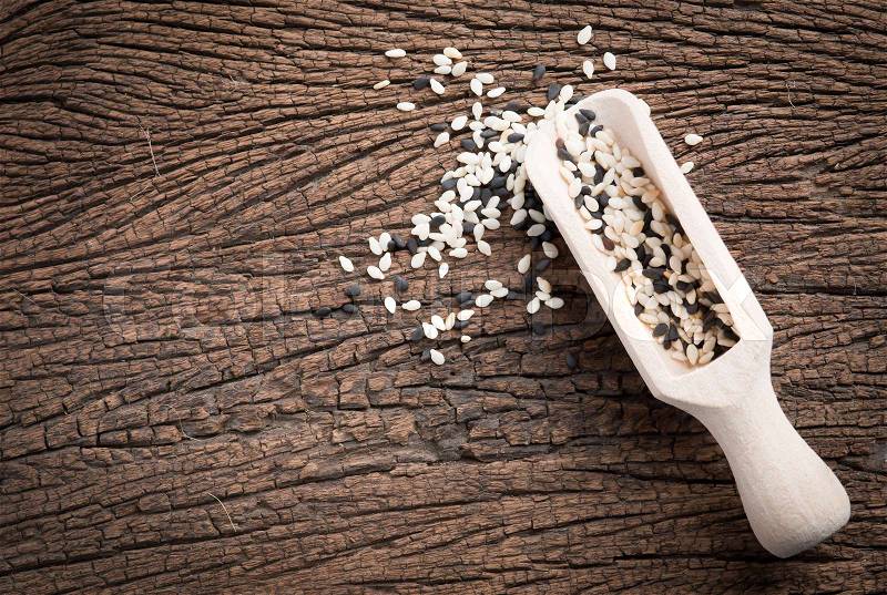 White sesame and black sesame seed on wooden,top view, stock photo