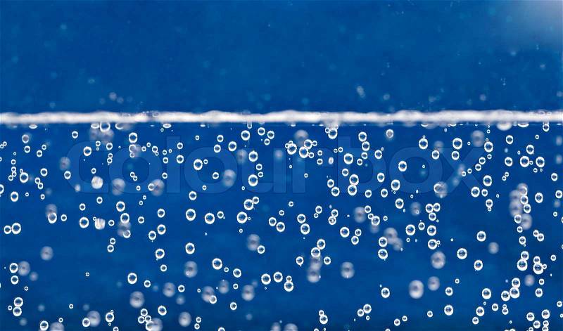 Carbonated water background with bubbles fizzling to the top, stock photo