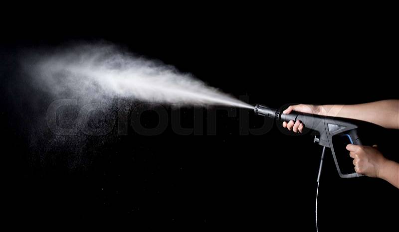 Water splashes with high pressure water jet on black background, stock photo