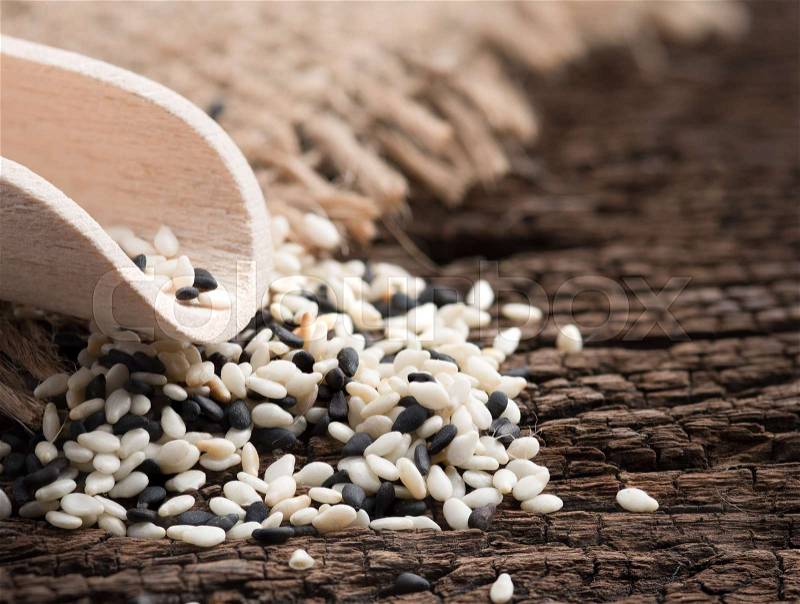 White sesame and black sesame seed on wooden , stock photo