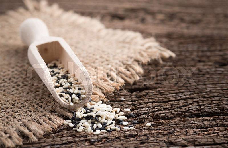 White sesame and black sesame seed on wooden , stock photo