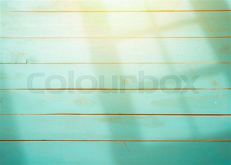 Wooden background with shadows from a window frame,morning light, stock photo