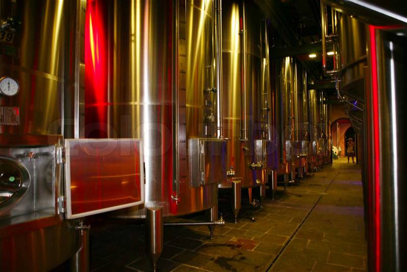 Modern stainless steel fermenting tanks for wine making, stock photo