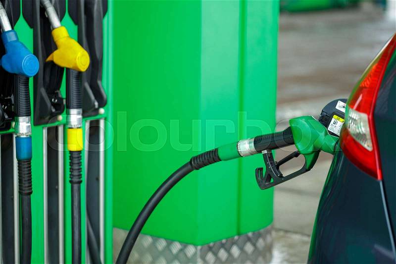 Car refueling on a petrol station in winter close up, stock photo