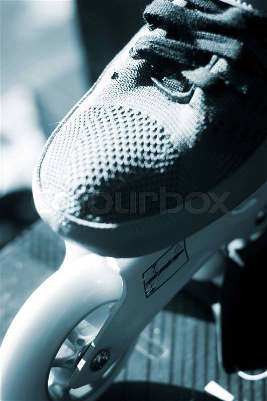 Inline freestyle new roller skates in retail skate shop window display on sale, stock photo