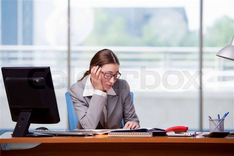 Sad businesswan in the office at work, stock photo
