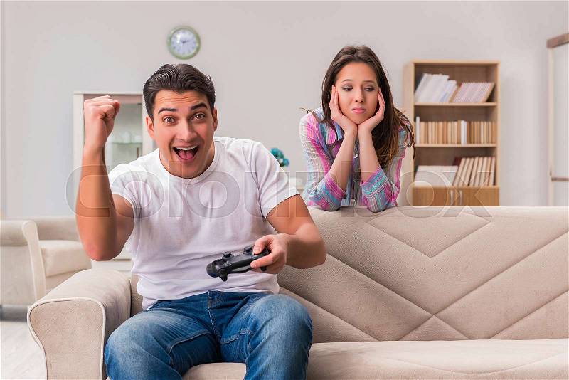 Young family suffering from computer games addiction, stock photo
