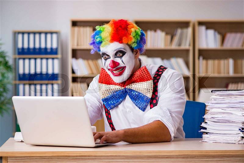 Clown businessman working in the office, stock photo