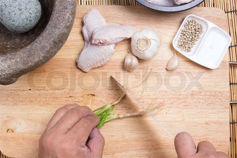 Chef cutting coriander with knife / cooking fried chicken wings concepted, stock photo