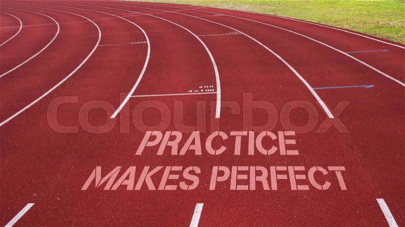 Motivational quote written on running track: Practice Makes Perfect, stock photo