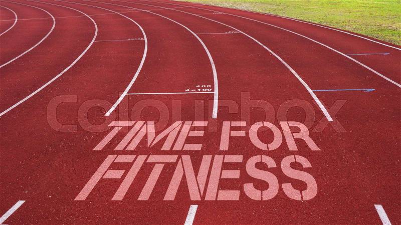 Motivational quote written on running track : Time For Fitness, stock photo