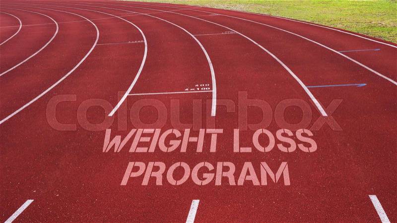 Motivational quote written on running track : Weight Loss Program?, stock photo