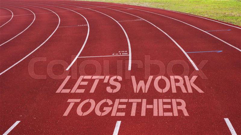 Motivational quote written on running track : Let\'s Work Together, stock photo