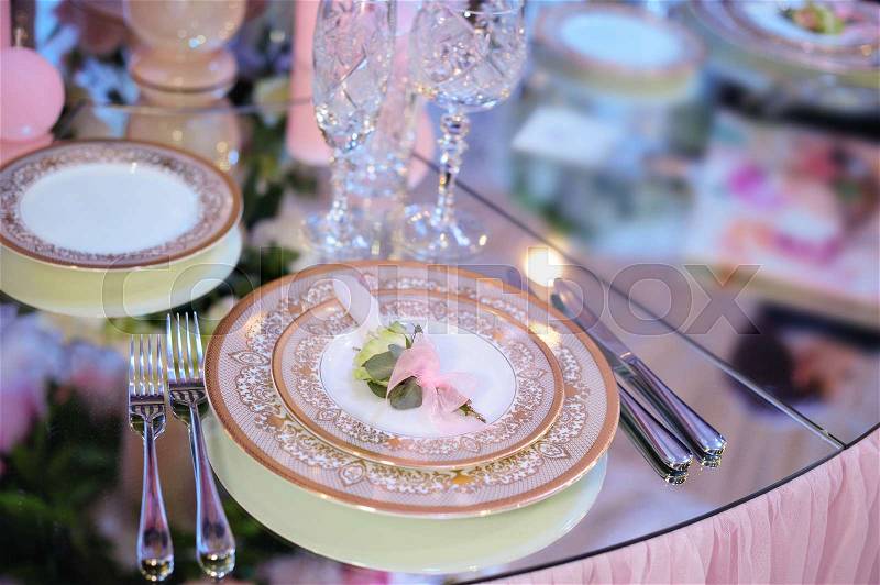 Beautiful tableware in the restaurant for a wedding banquet, stock photo
