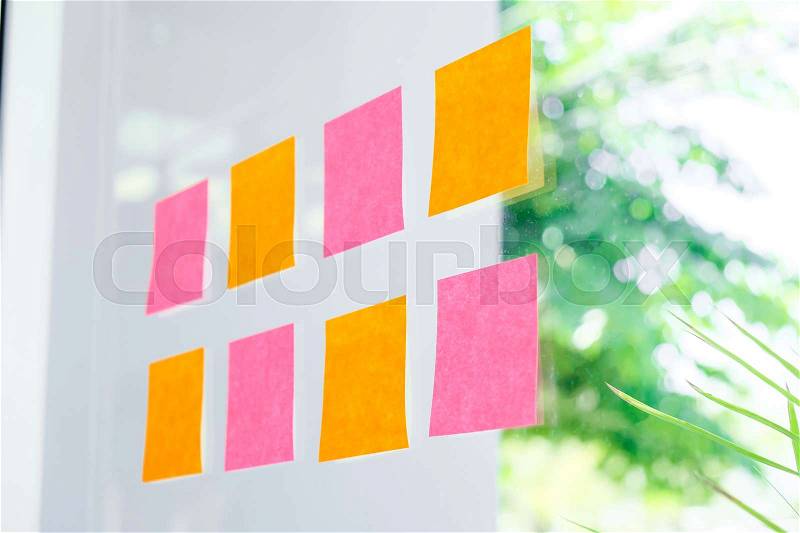 Sticky note paper reminder schedule board. Business people meeting and use post it, stock photo