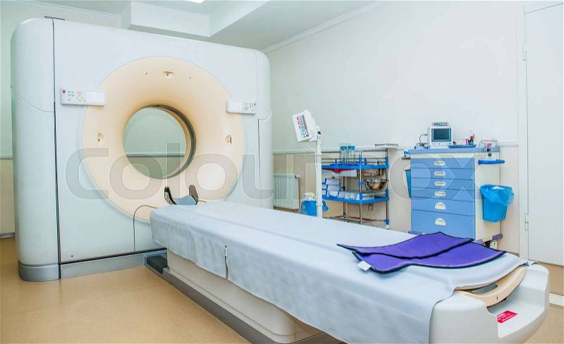 Computed tomography or computed axial tomography scan machine in hospital room, stock photo