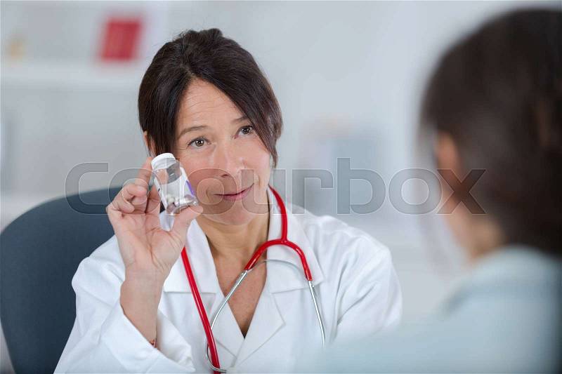 Showing the medicine, stock photo