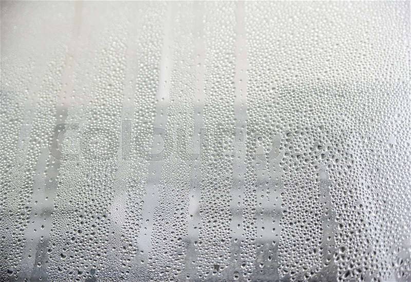 View on drops of wet window background, stock photo
