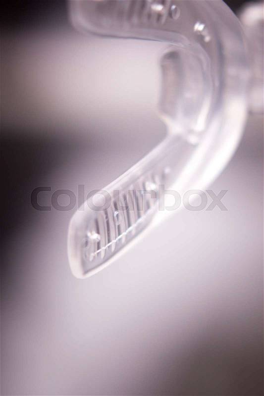 Dental braces aligners accelerator for both modern invisible and metal brackets to straighten and align teeth, stock photo