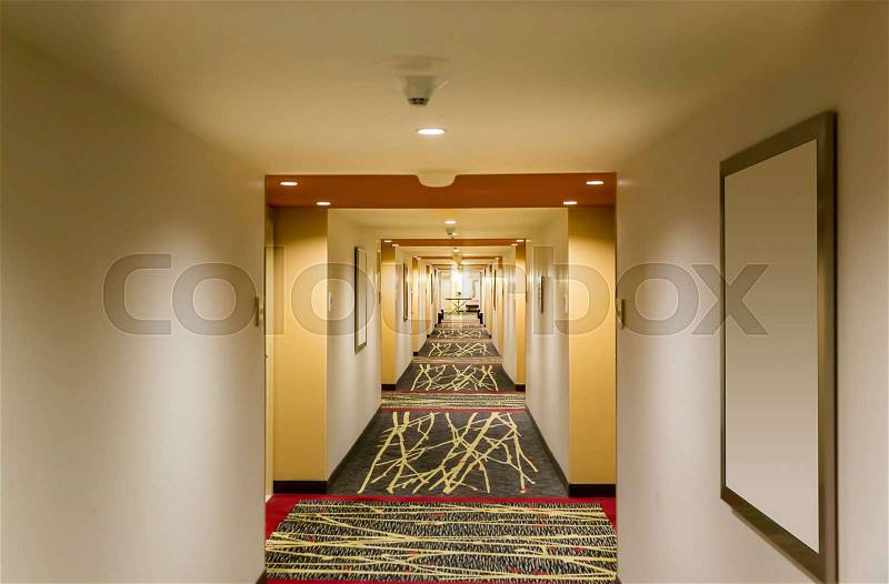 Hotel corridor interior with carpet. Empty hotel hallway, stock photo