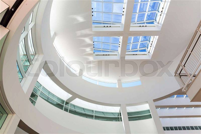 High tech building with glassed roof and white walls, stock photo