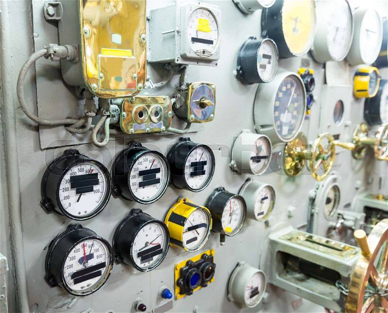 Marine museum exhibition on military ship includes gauges and control equipment, stock photo