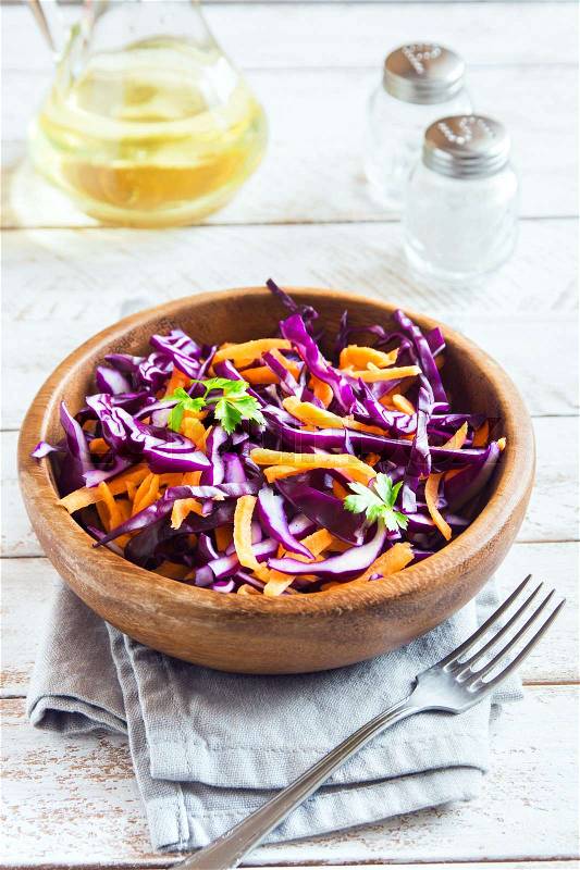 Red Cabbage Coleslaw Salad with Carrots and Greens - healthy diet, detox, vegan, vegetarian, vegetable spring salad, stock photo